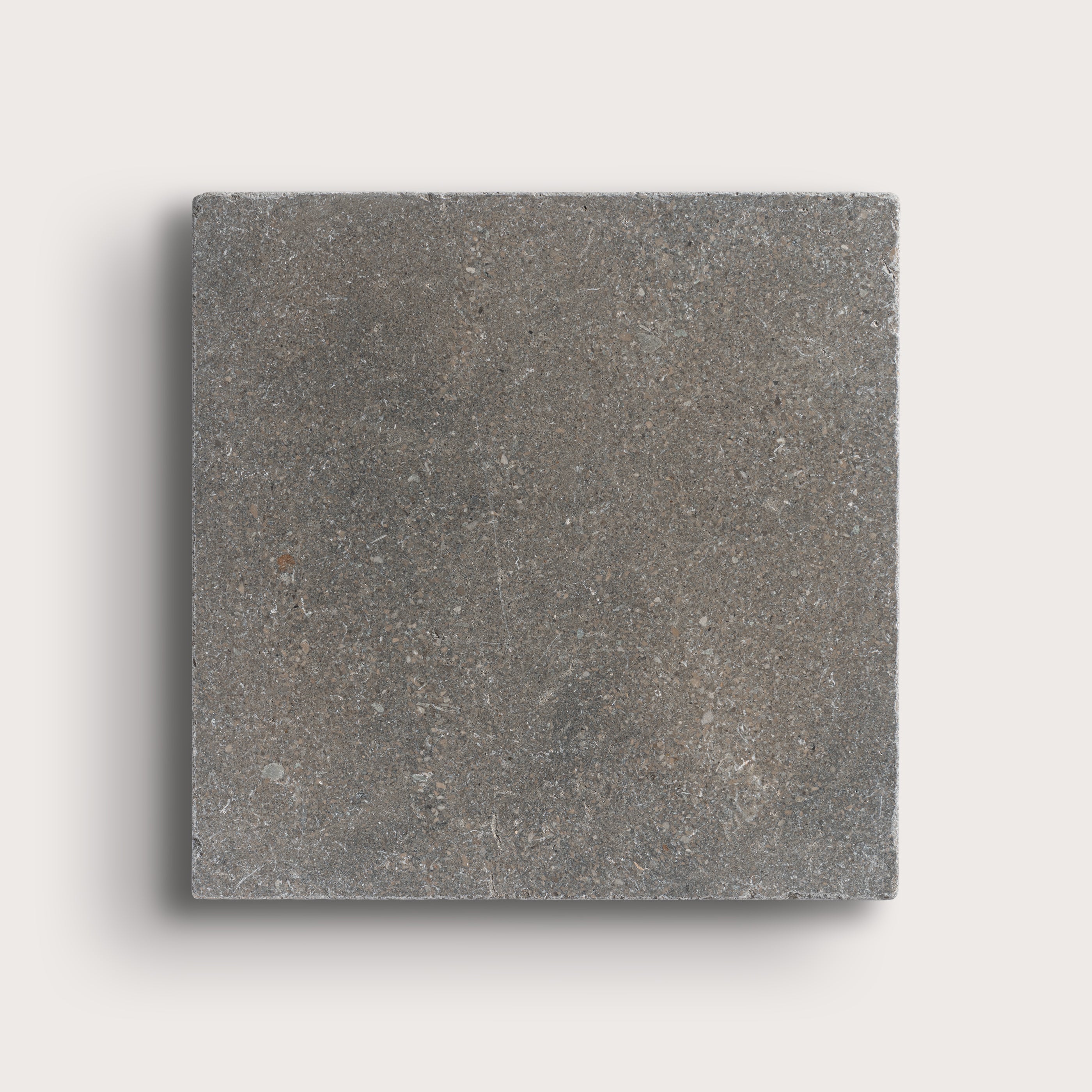 grey square limestone tile on light grey background