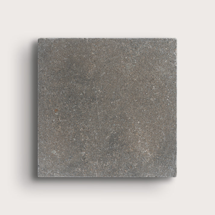grey square limestone tile on light grey background