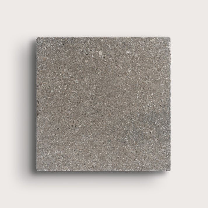 grey square limestone tile on light grey background