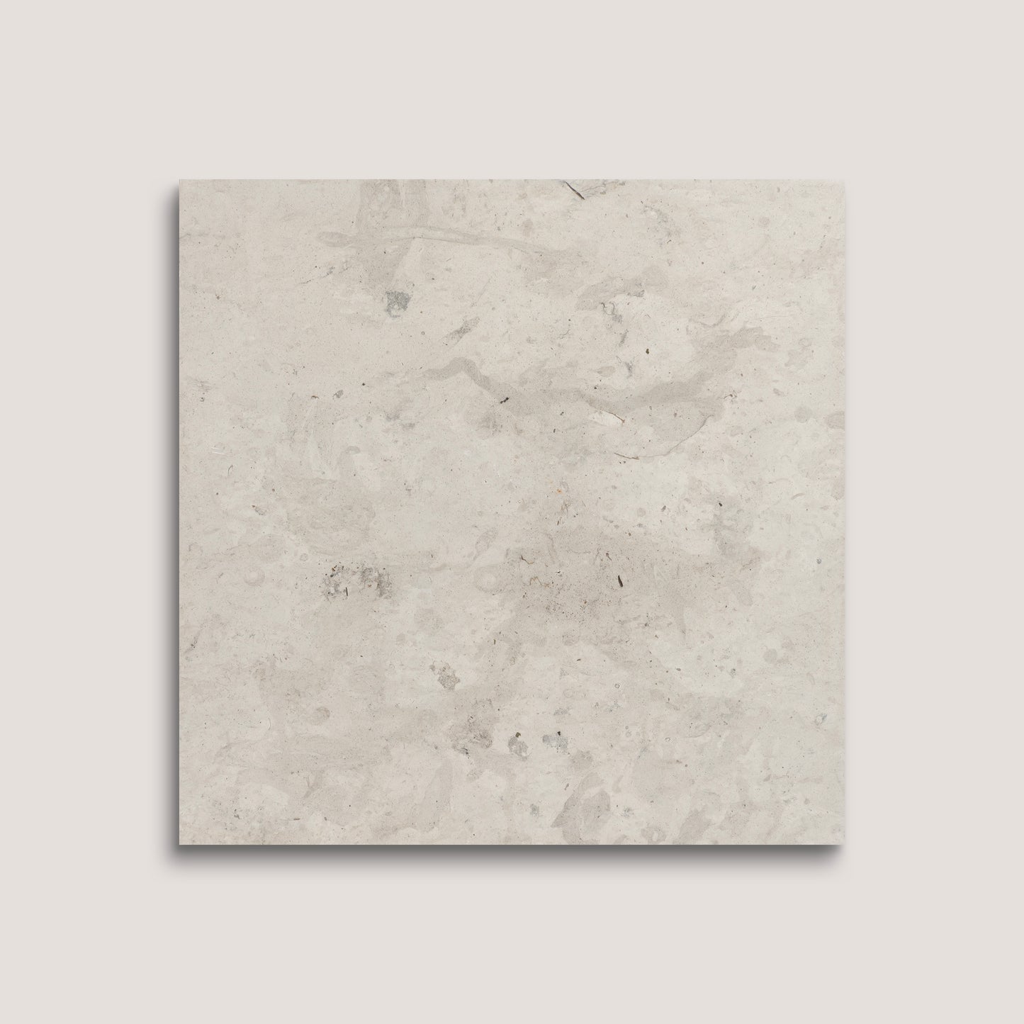 Square tile with a light gray, textured surface on a white background