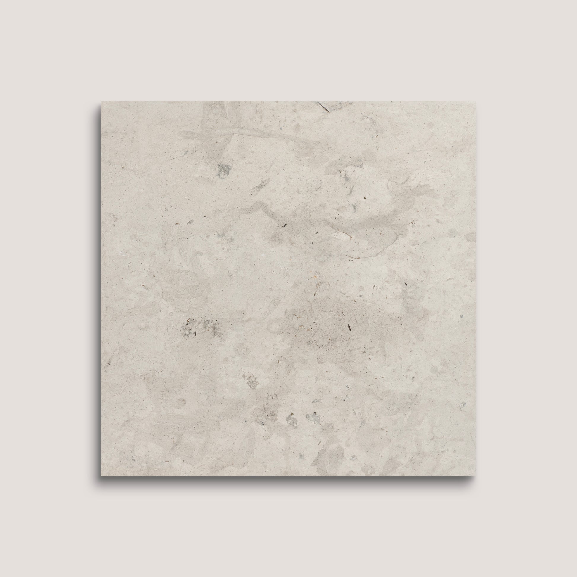 Square tile with a light gray, textured surface on a white background