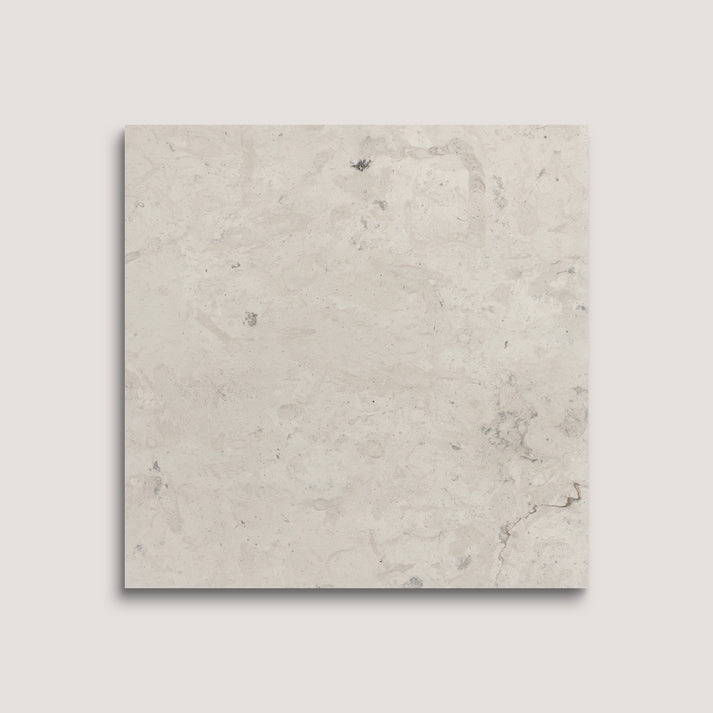 Square tile with a light gray marbled pattern on a white background