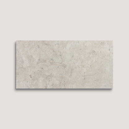 Rectangular limestone tile on a light gray background