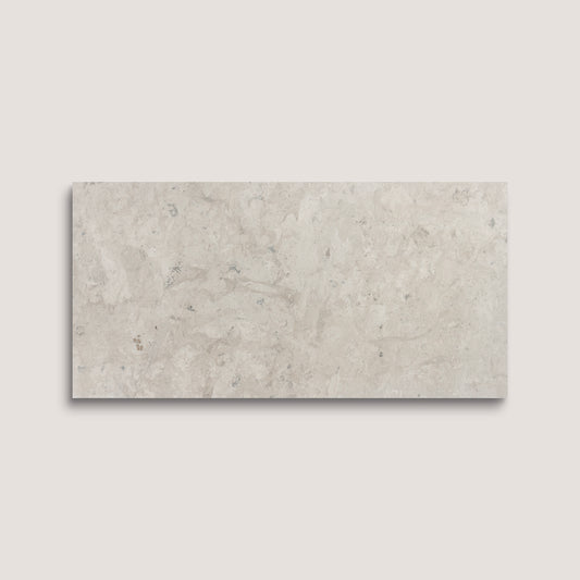 Rectangular limestone tile on a light gray background