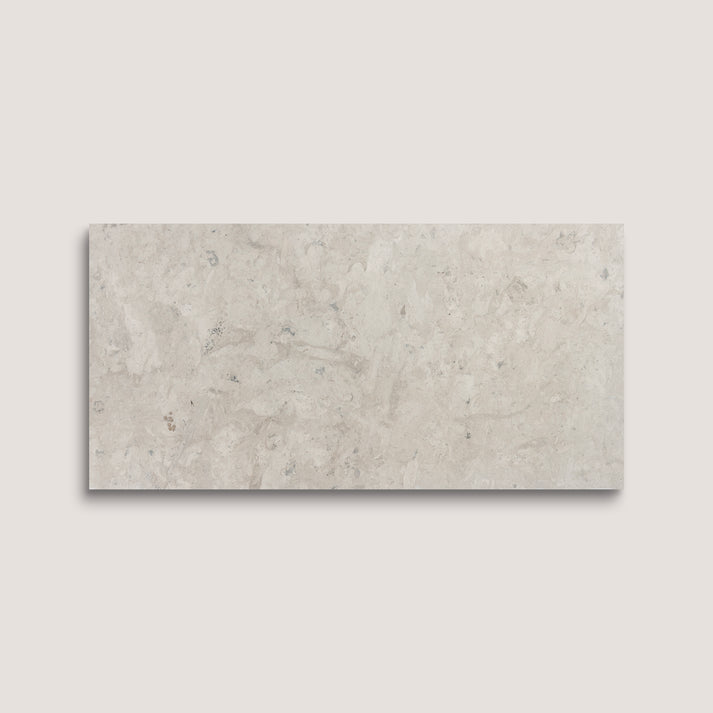Rectangular limestone tile on a light gray background