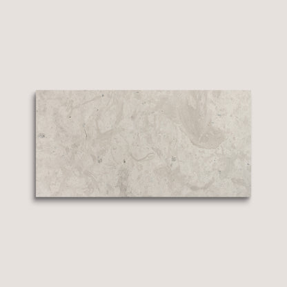 Rectangular limestone tile on a light gray background