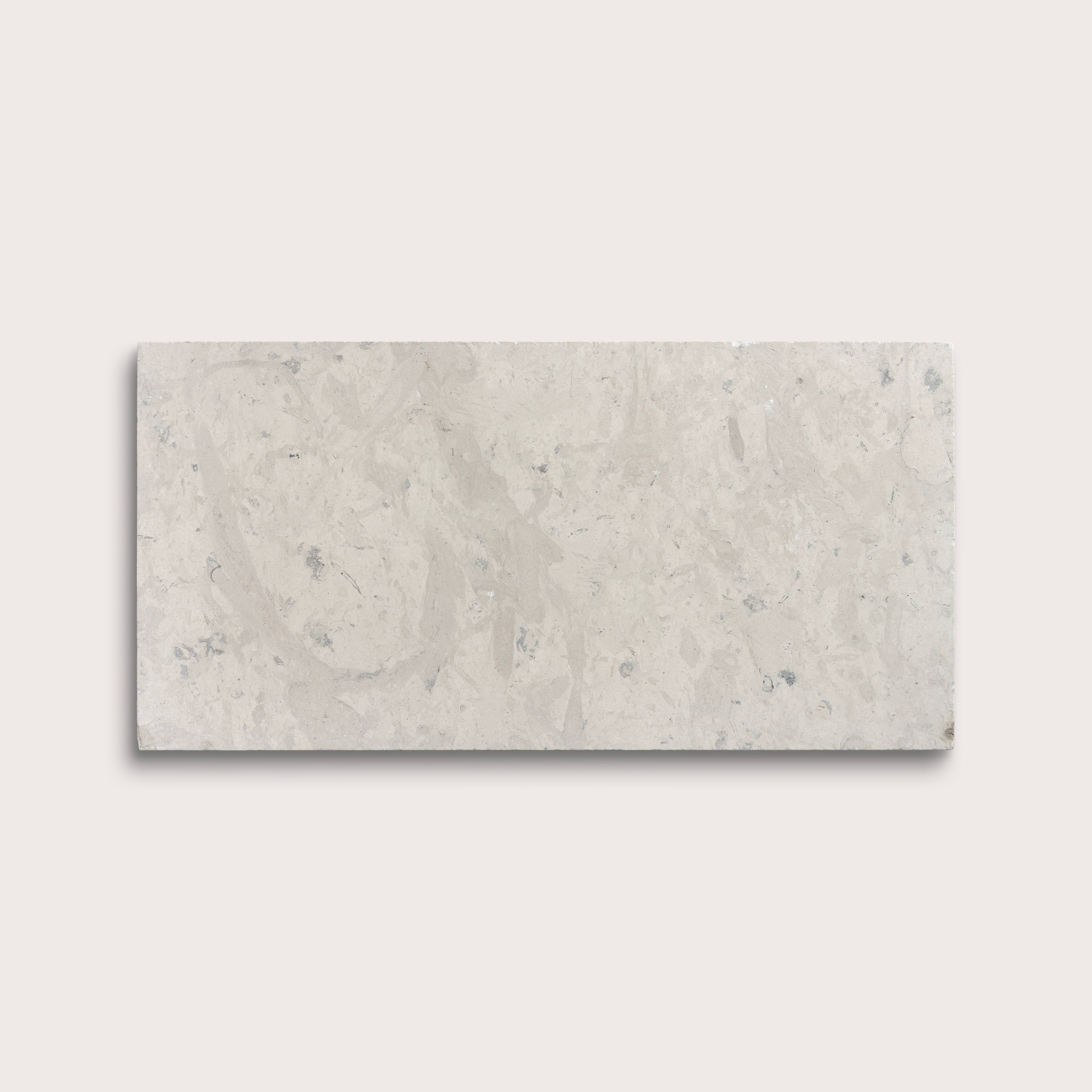 Rectangular limestone tile with a gray pattern on a light gray background