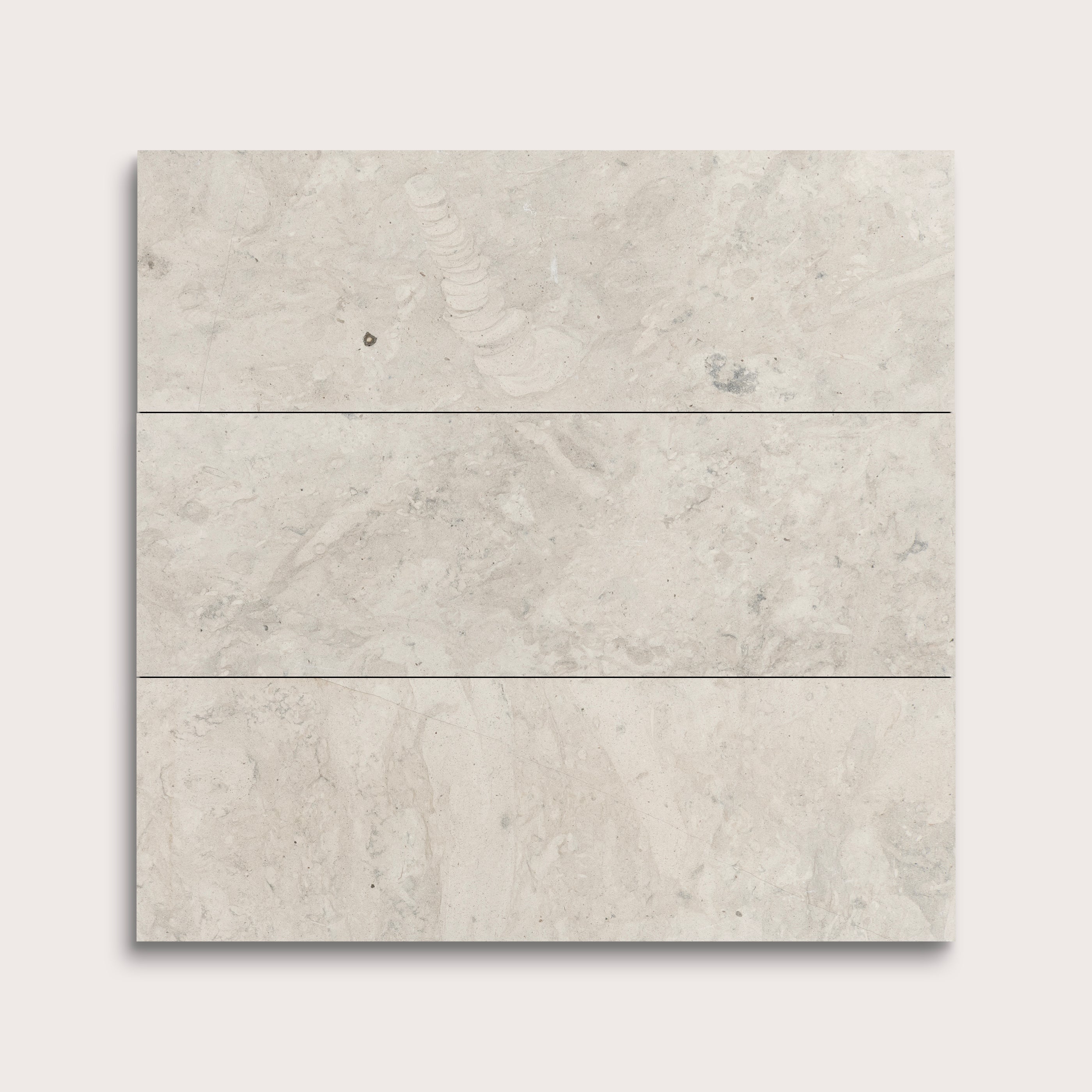 three rectangular tiles with a grey limestone pattern on a white background