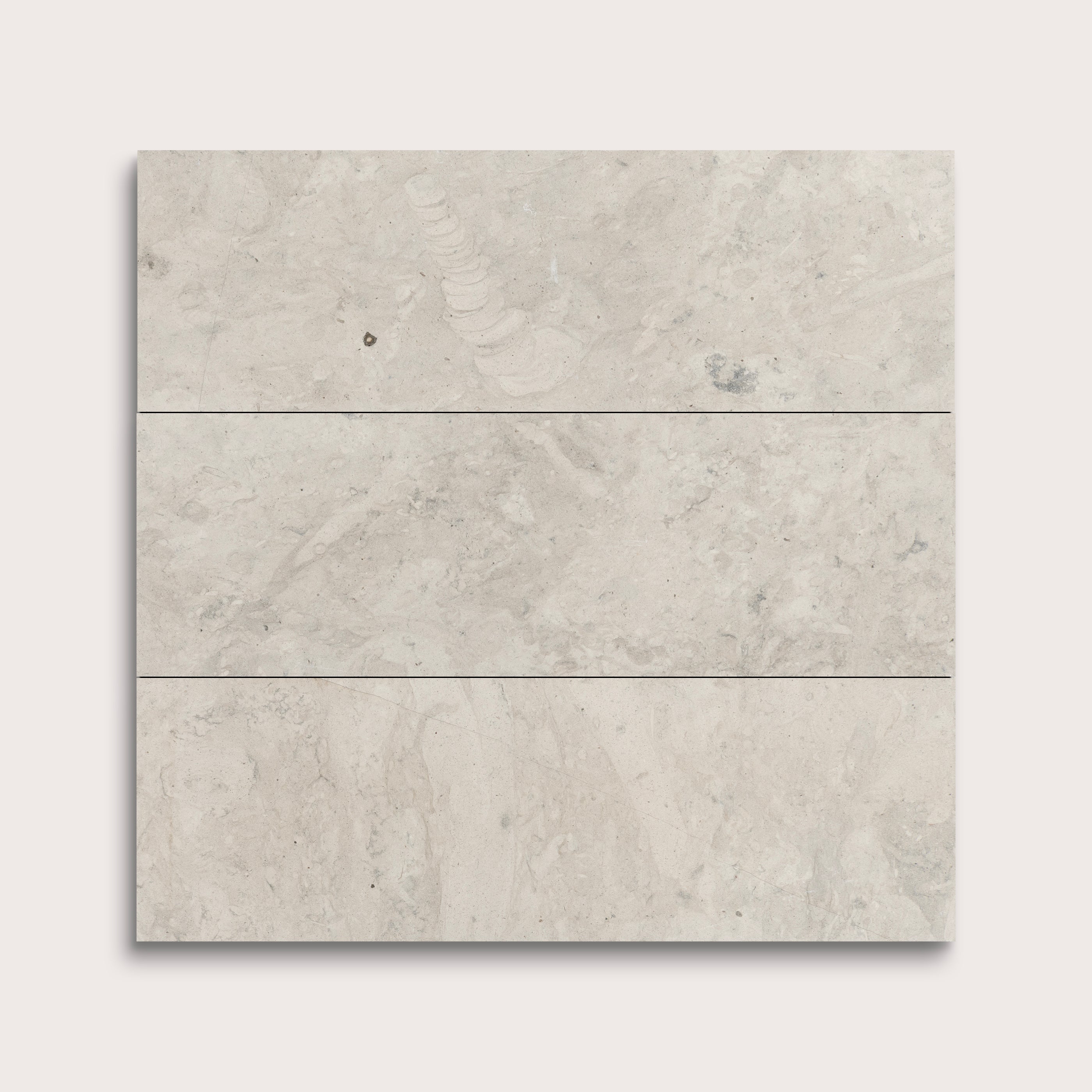 Three gray limestone tiles arranged vertically on a white background