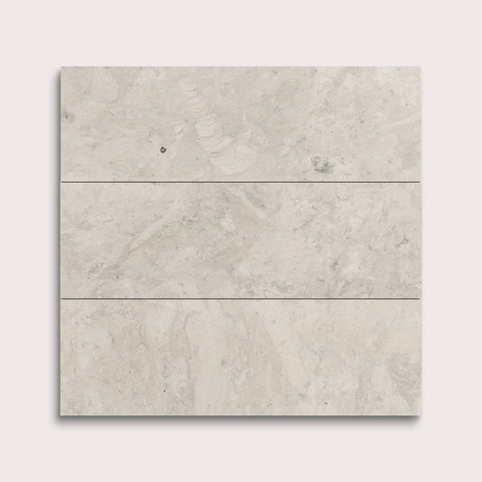 Three gray limestone tiles arranged vertically on a white background
