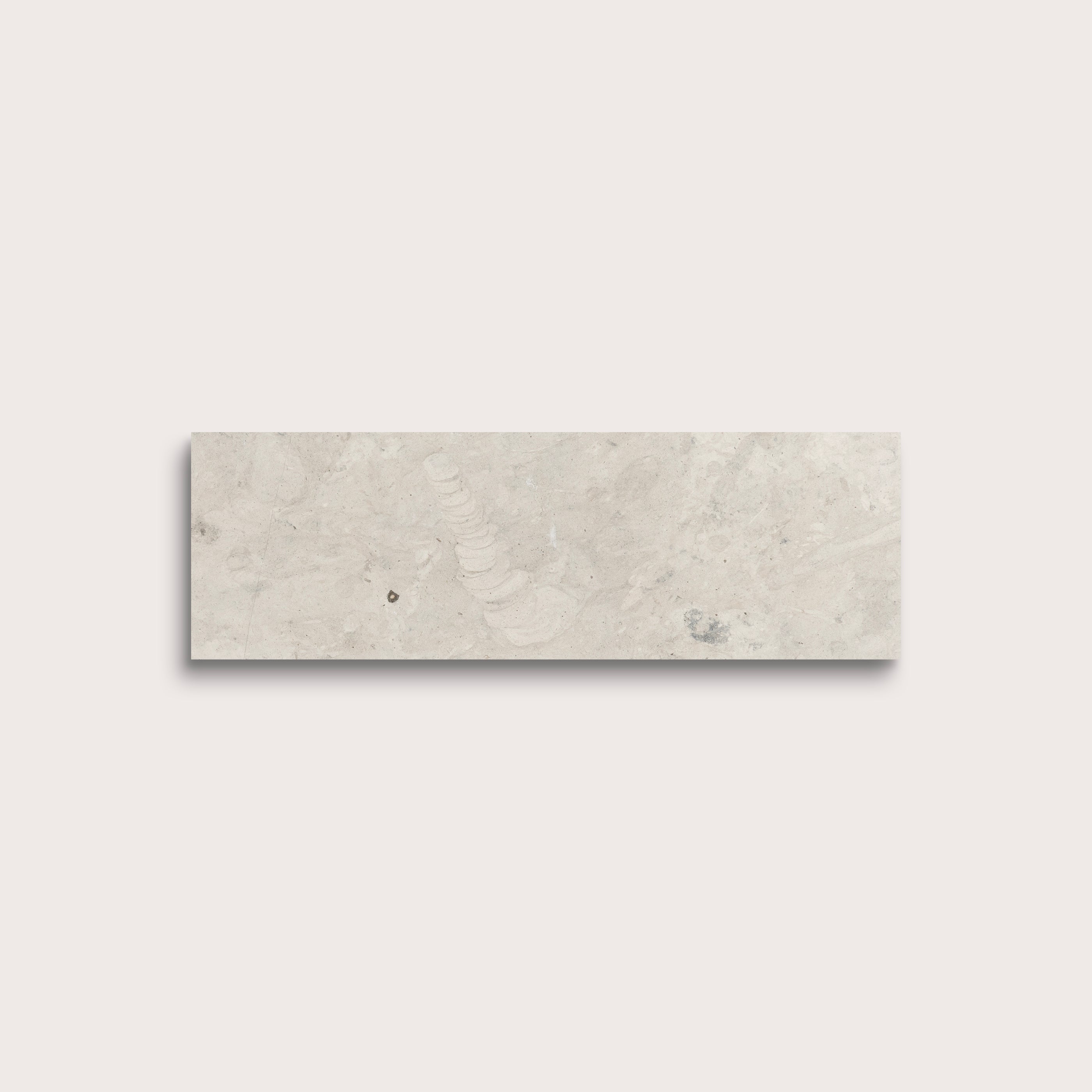 rectangular tile with a grey limestone pattern on a white background