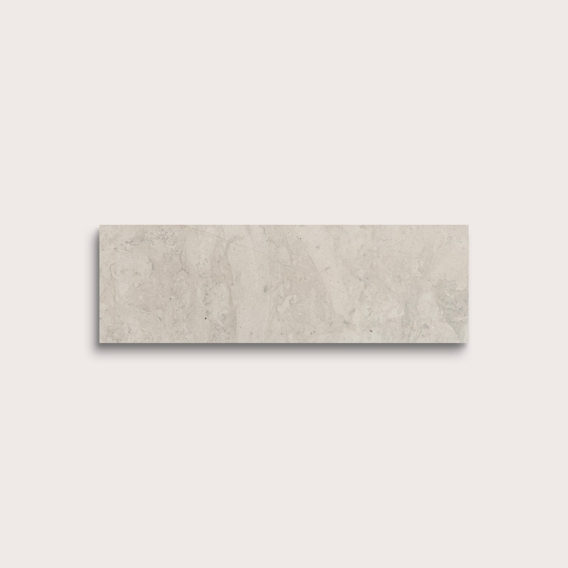 Rectangular beige tile on a light gray background