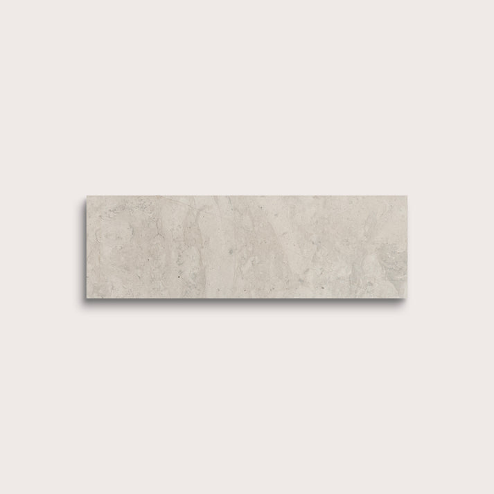 Rectangular beige tile on a light gray background