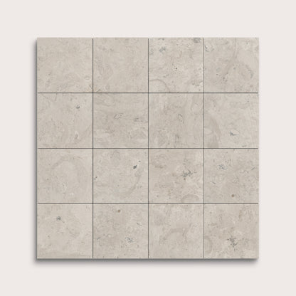 Square tiles with a light gray pattern on a white background