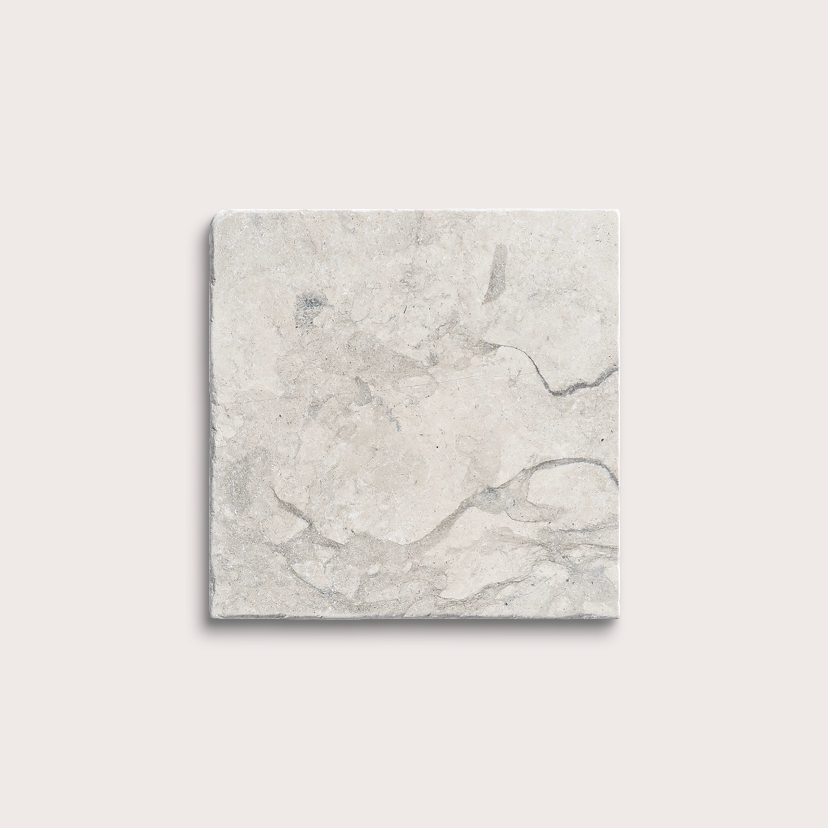 square tile with a grey limestone pattern on a white background