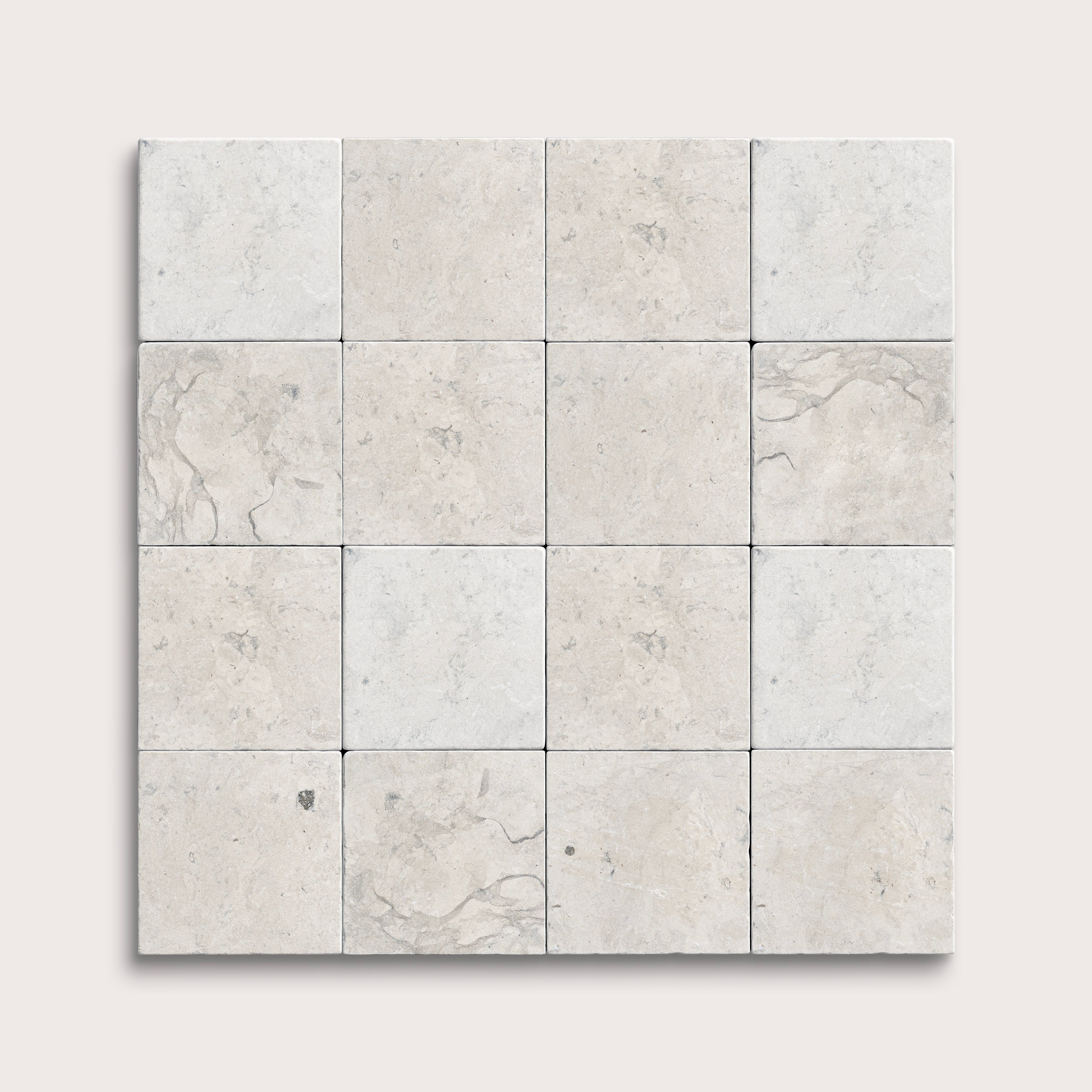 sixteen square tiles with a grey limestone pattern on a white background