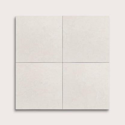 four square tiles with a white limestone pattern on a white background