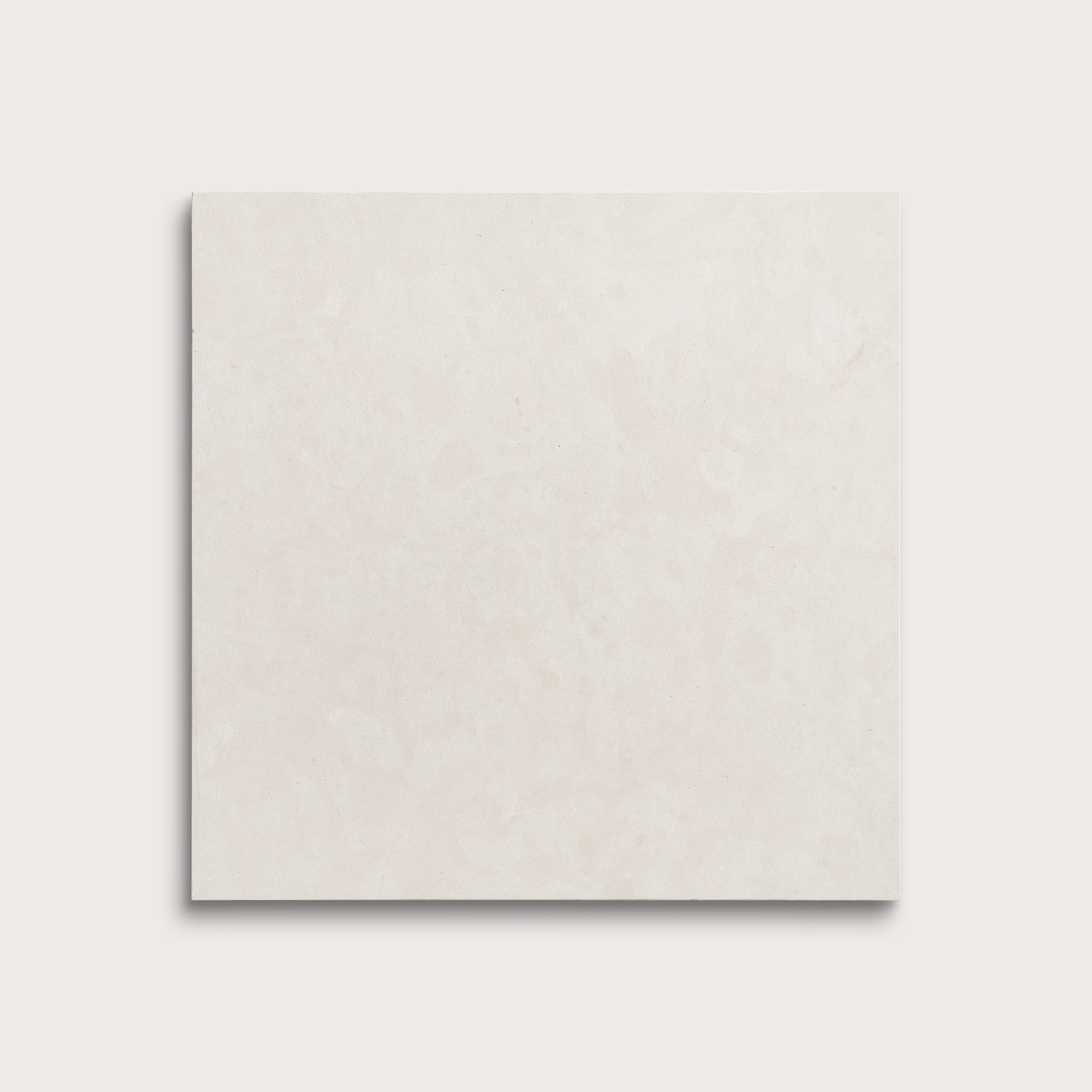 square tile with a white limestone pattern on a white background