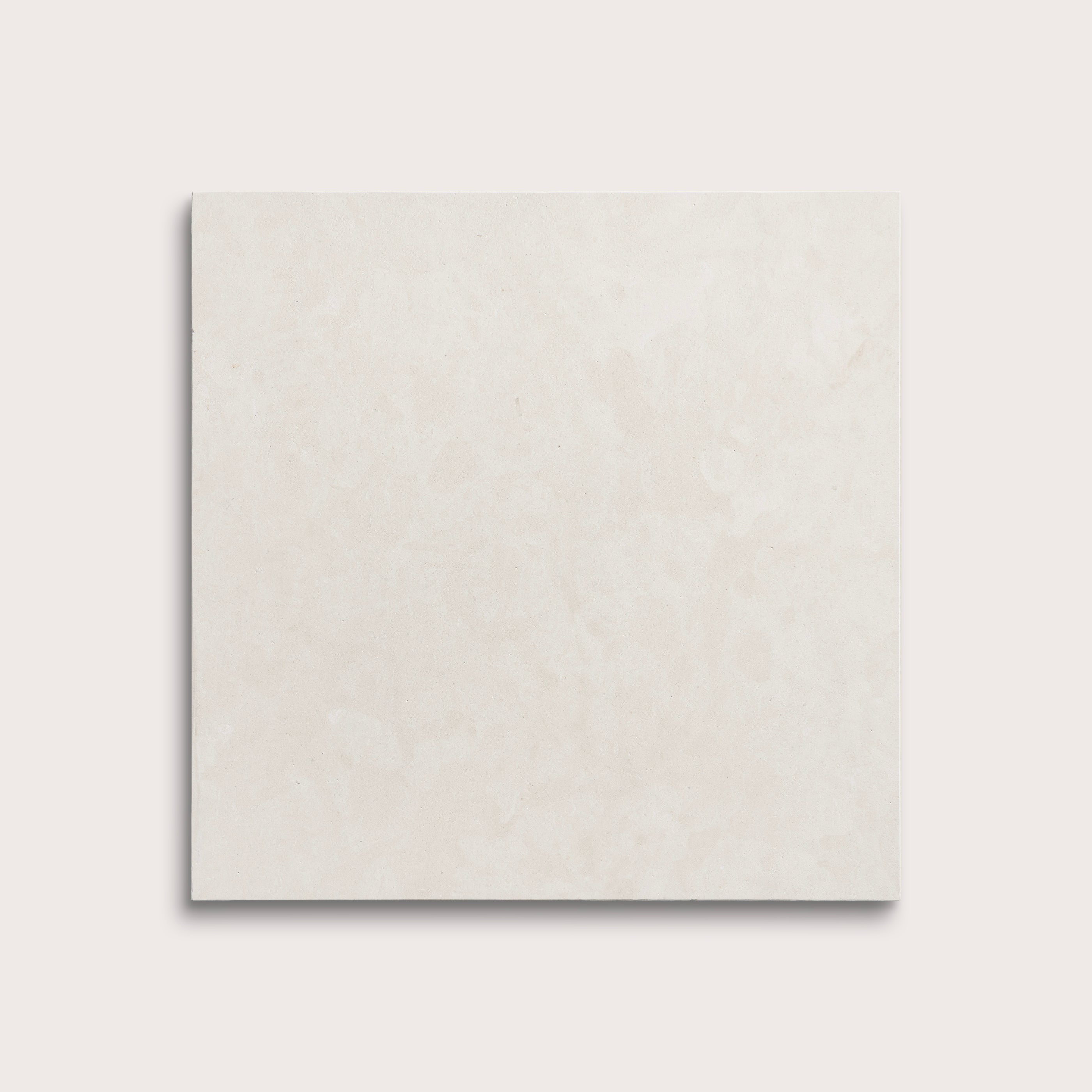 square tile with a white limestone pattern on a white background
