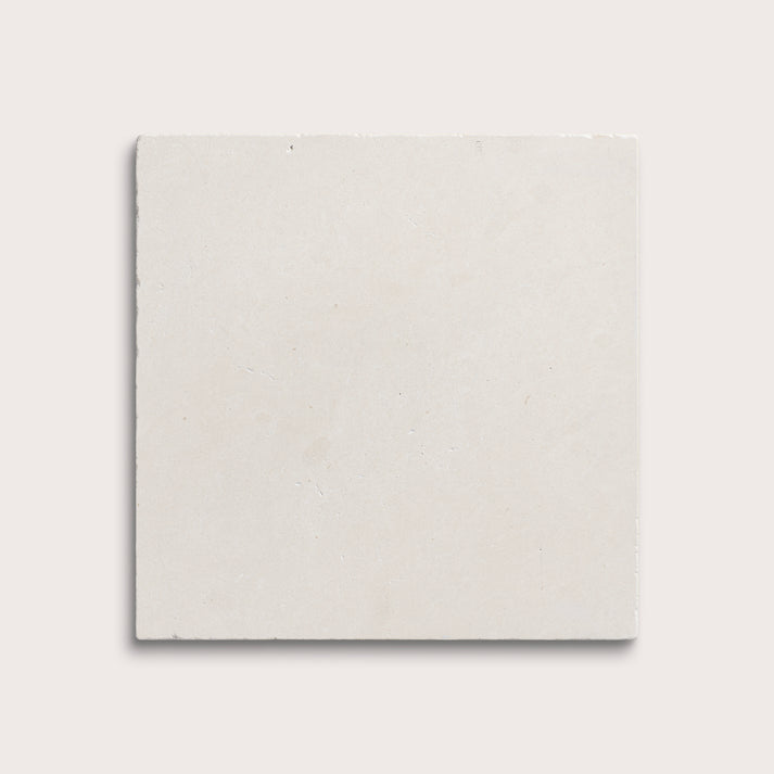 square tile with a white limestone pattern on a white background