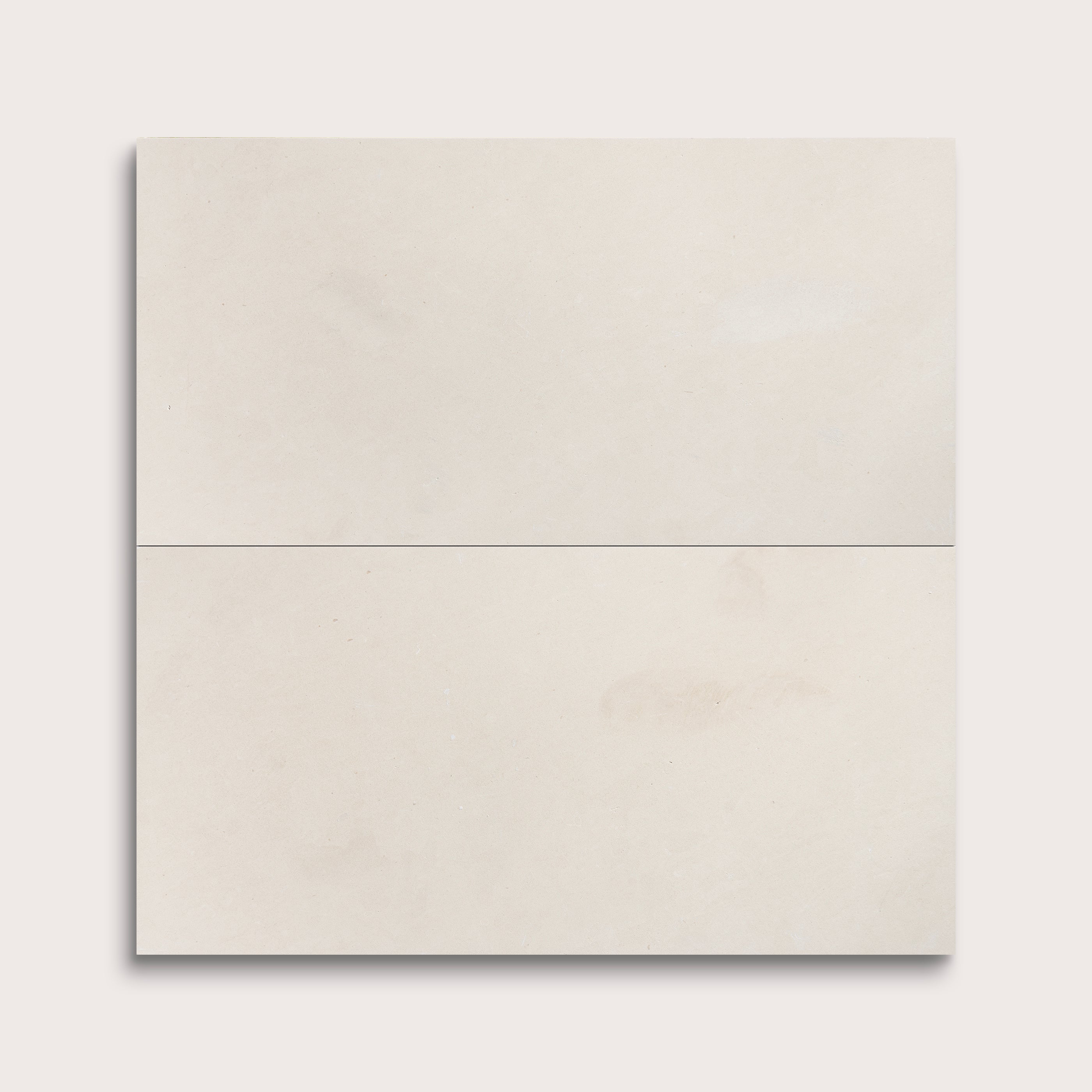 two rectangle tiles with a white limestone pattern on a white background