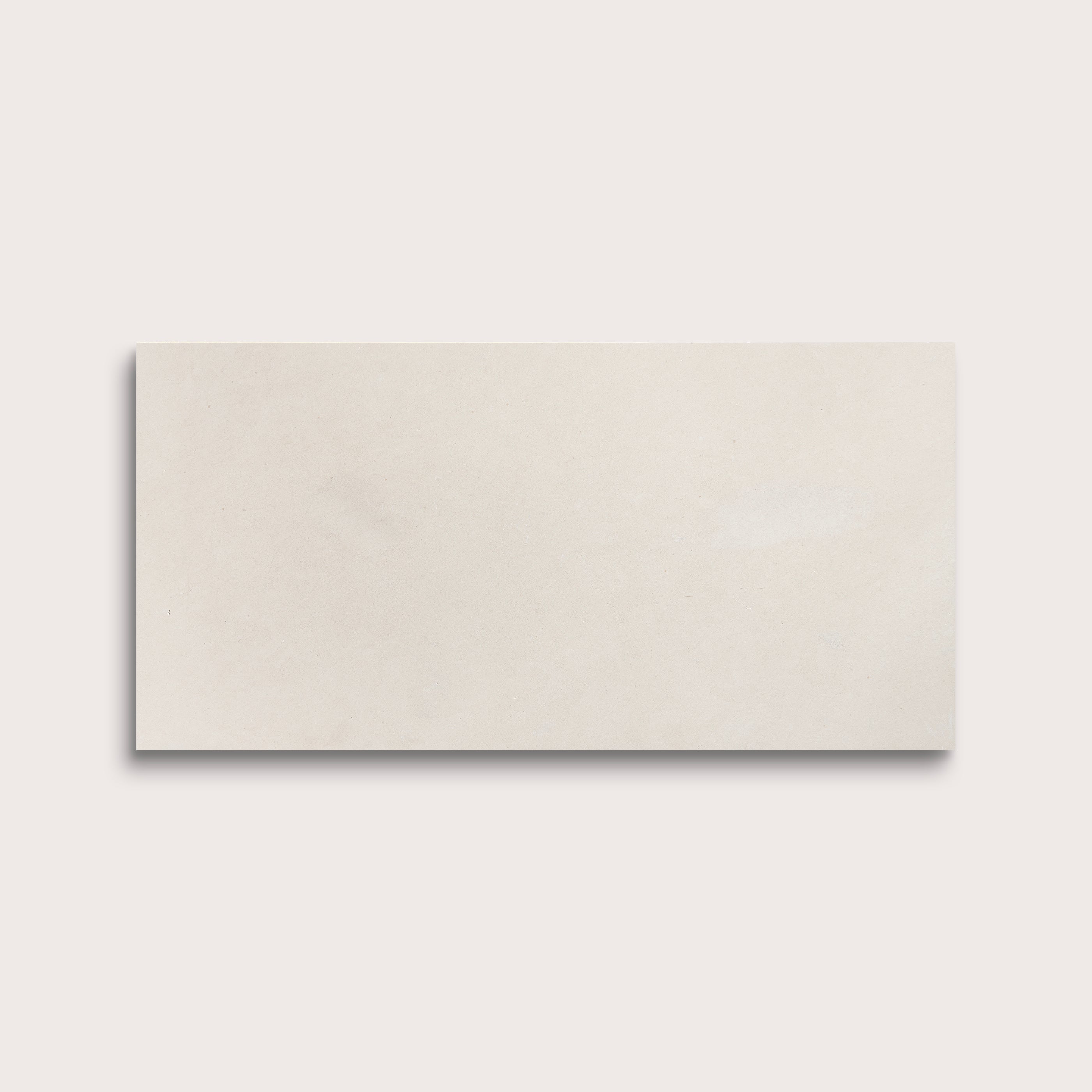 one rectangle tile with a white limestone pattern on a white background