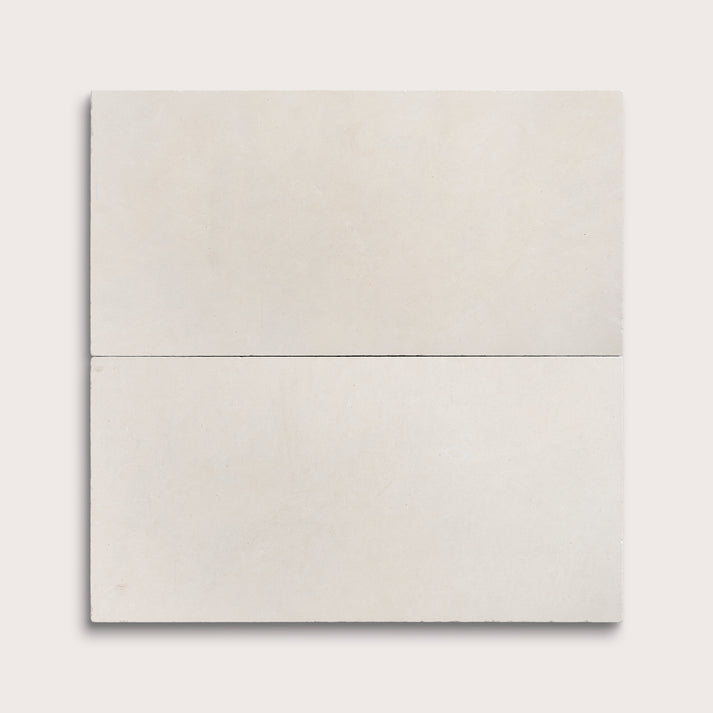 two rectangle tiles with a white limestone pattern on a white background