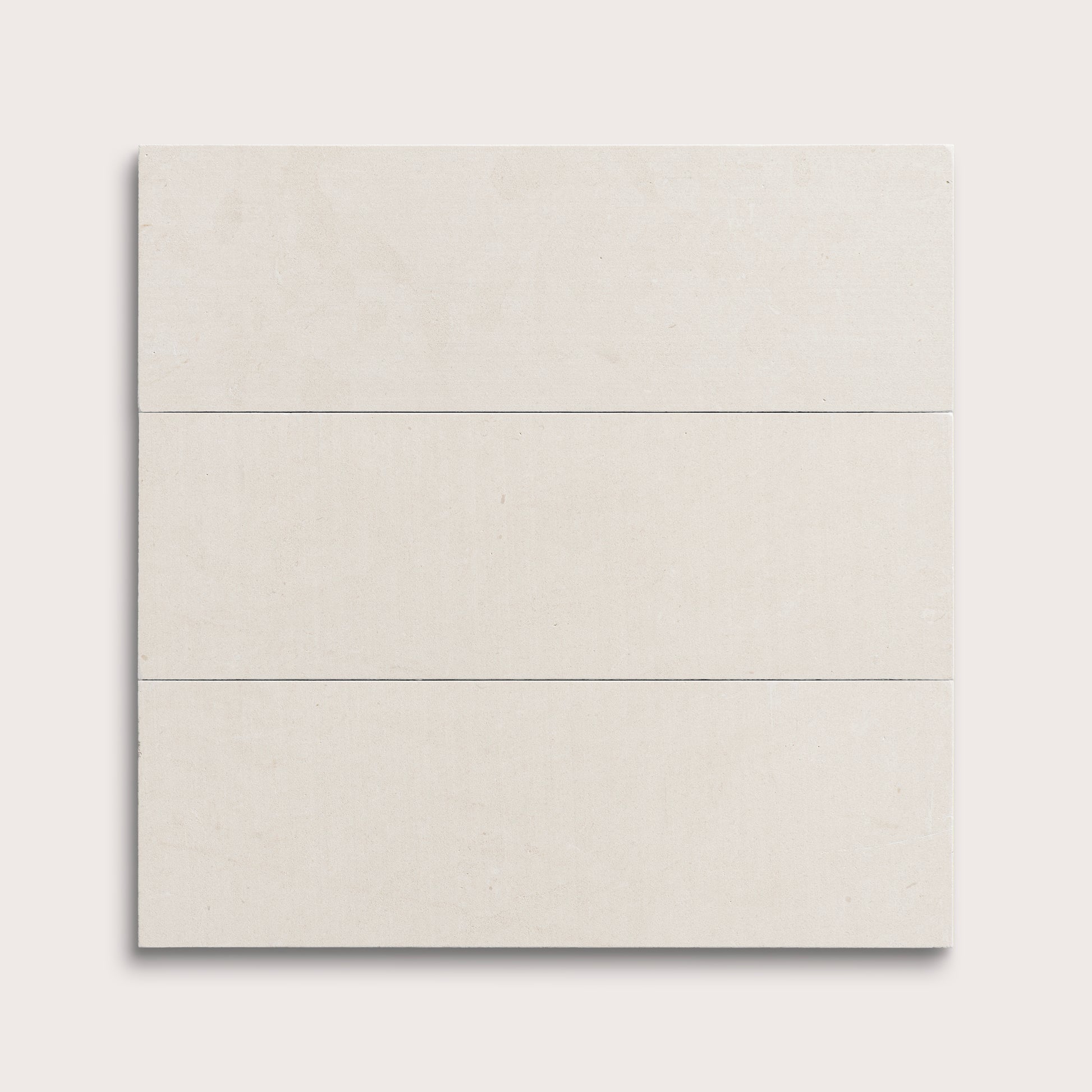 three rectangular tiles with a white limestone pattern on a white background