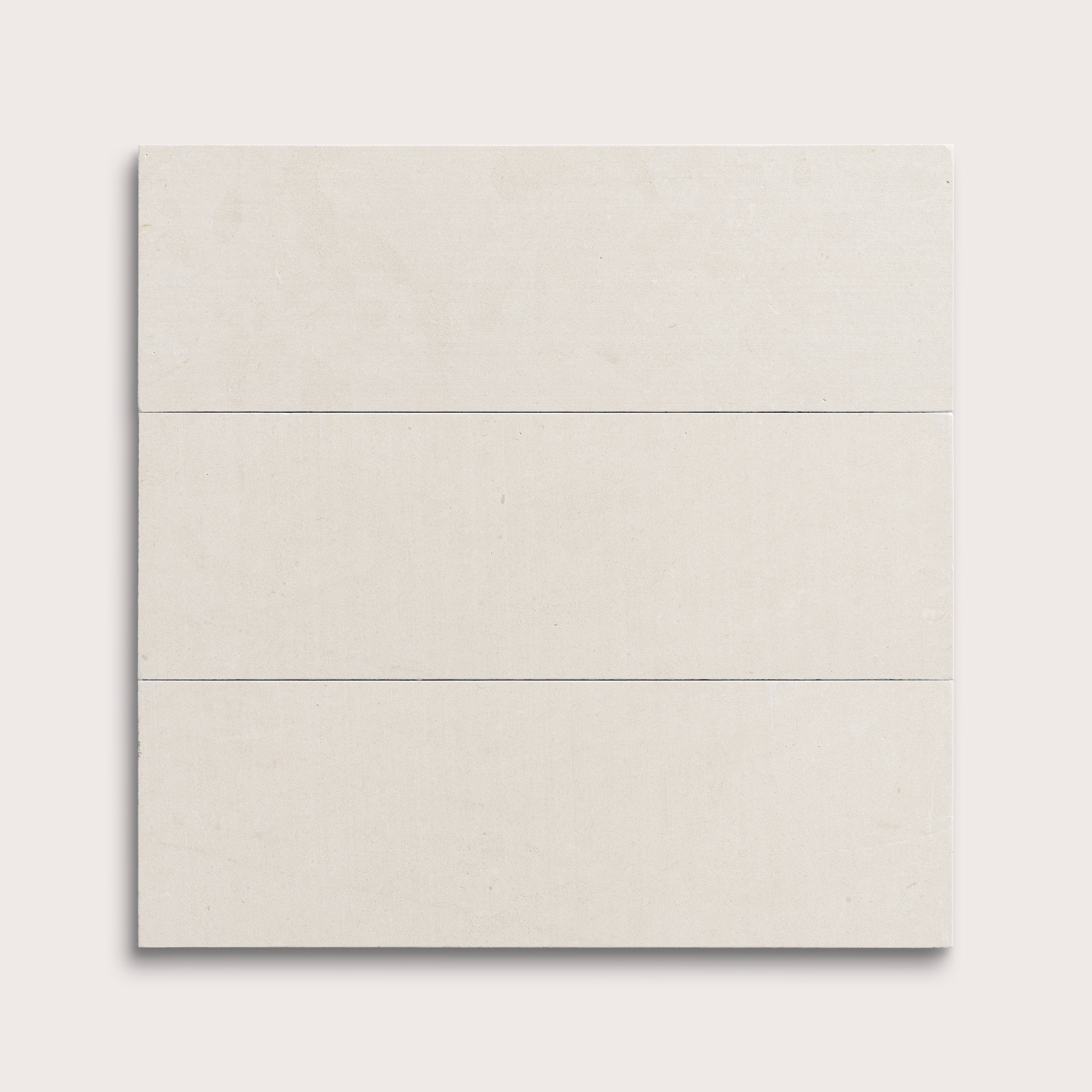 three rectangular tiles with a white limestone pattern on a white background
