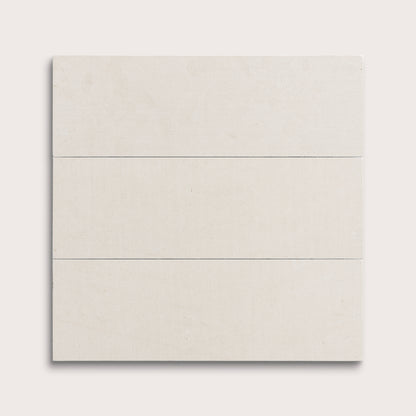 three rectangular tiles with a white limestone pattern on a white background