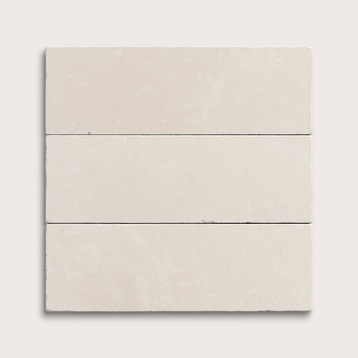 three rectangle tiles with a white limestone pattern on a white background