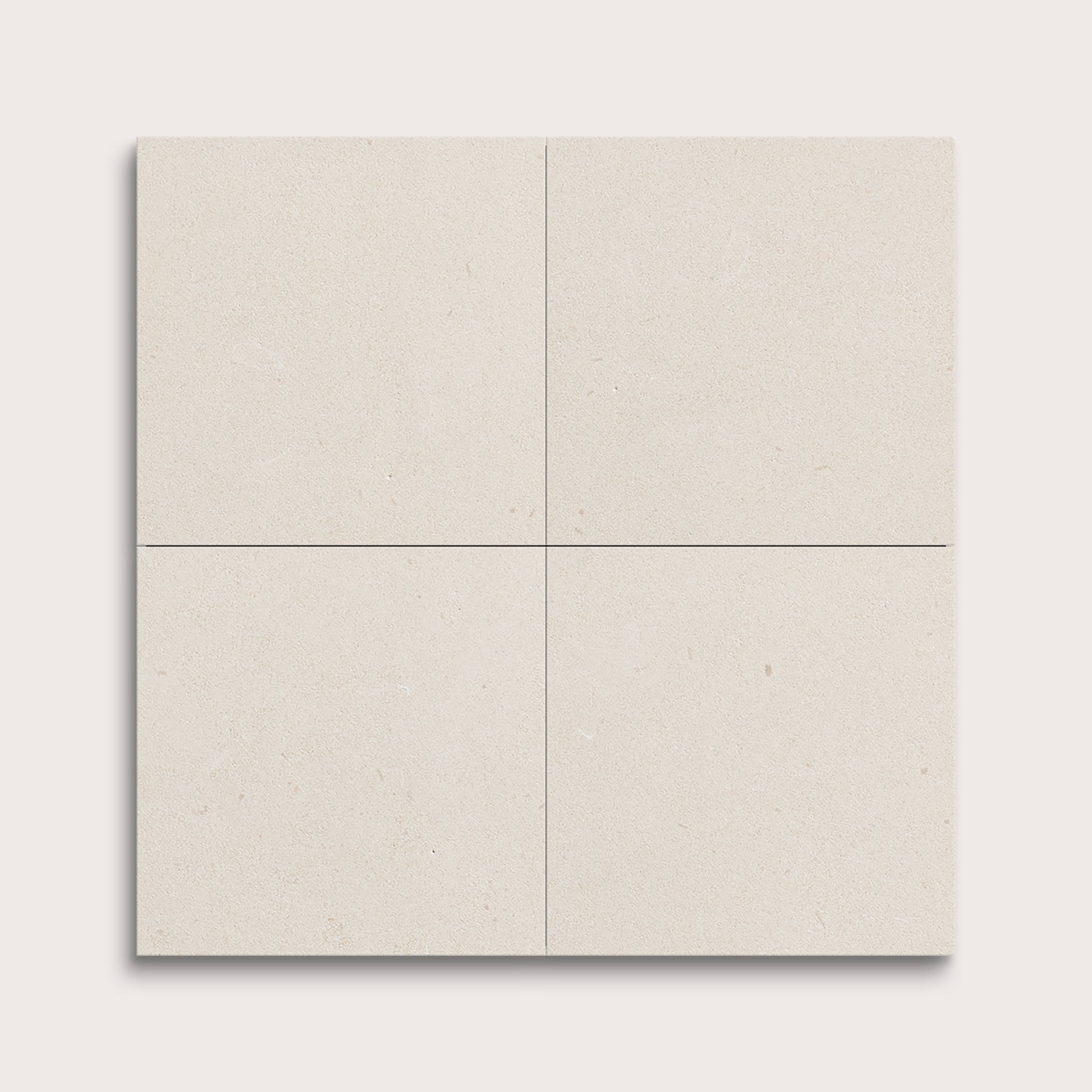 four square tiles with a white limestone pattern on a white background