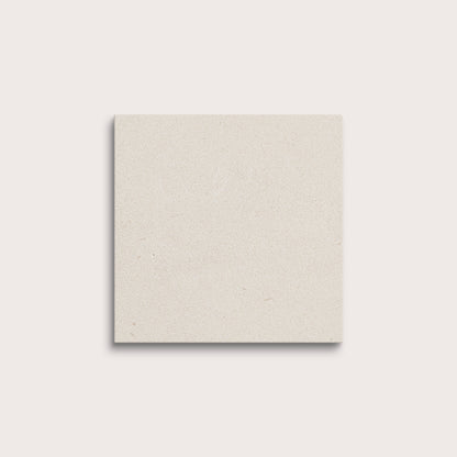 square tile with a white limestone pattern on a white background