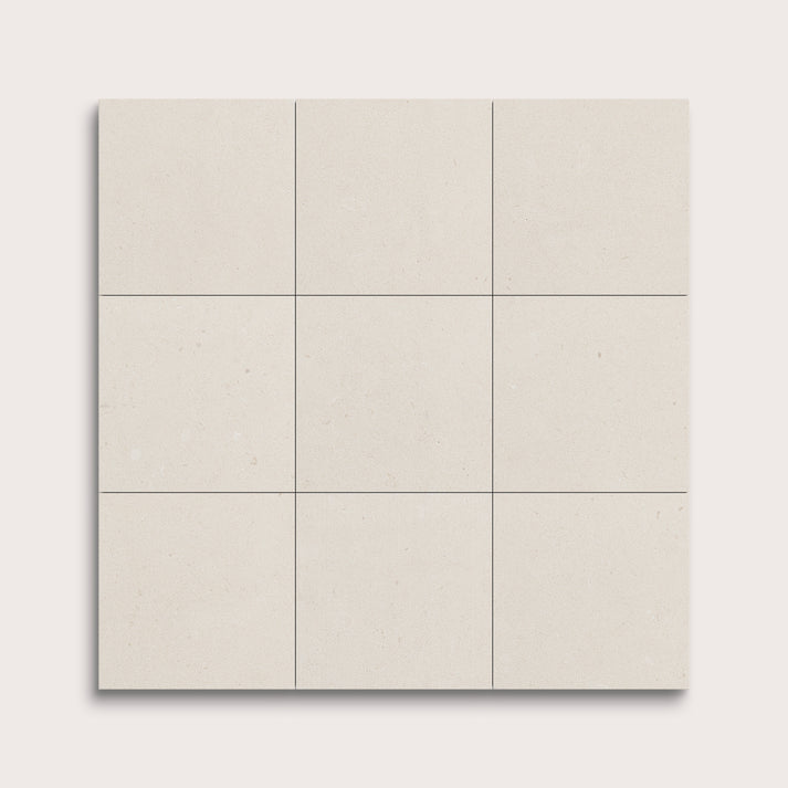 nine square tiles with a white limestone pattern on a white background
