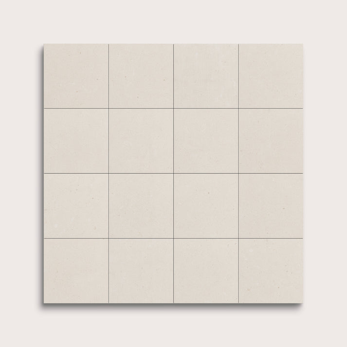 sixteen square tiles with a white limestone pattern on a white background