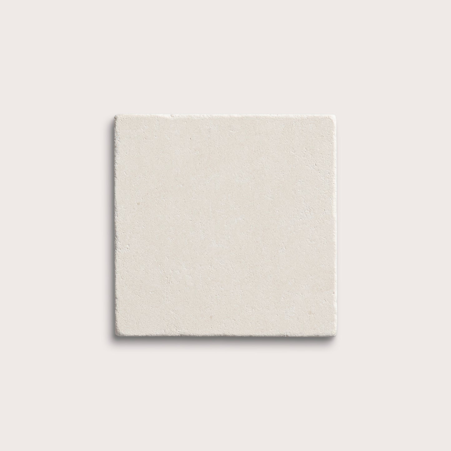 square tile with a white limestone pattern on a white background
