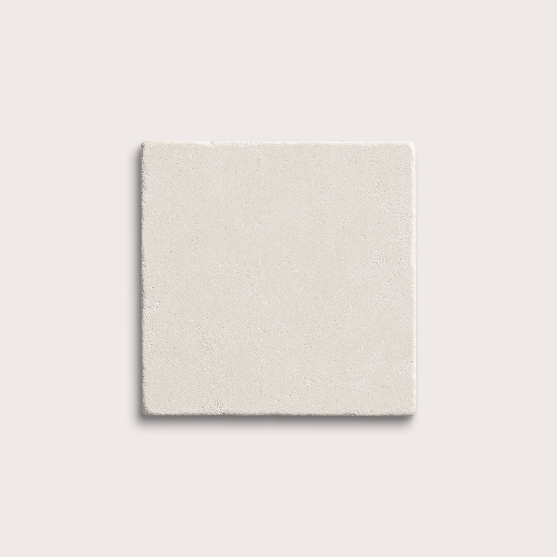 square tile with a white limestone pattern on a white background