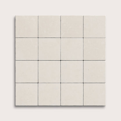 sixteen square tiles with a white limestone pattern on a white background