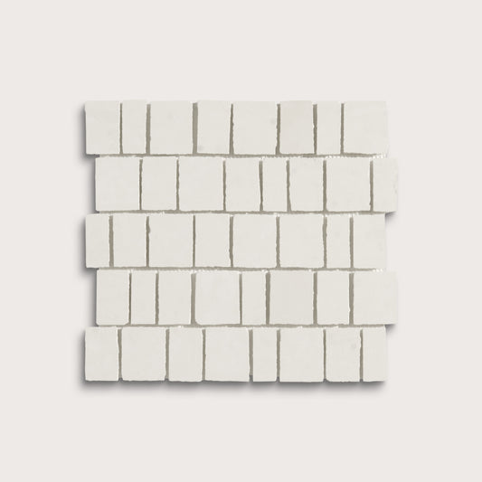 White rectangular mosaic tile sheets arranged in a staggered brick pattern on a light gray background.