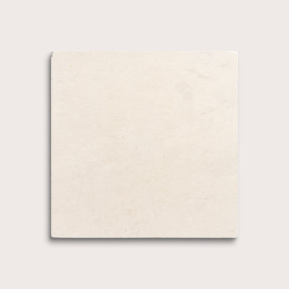square tile with a beige limestone pattern on a white background
