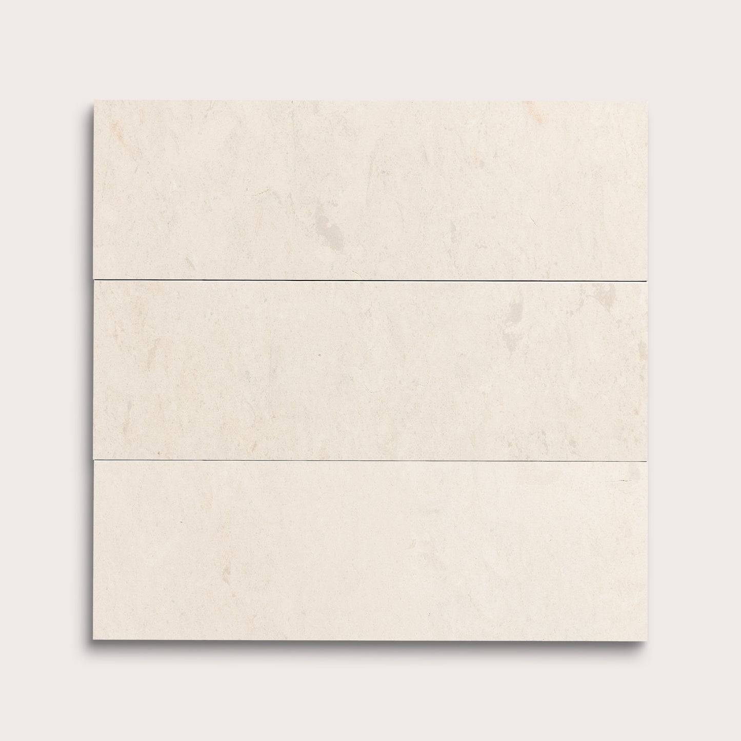 three rectangle tiles with a beige limestone pattern on a white background