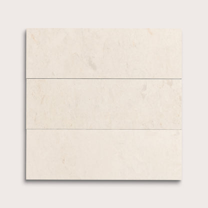 three rectangle tiles with a beige limestone pattern on a white background