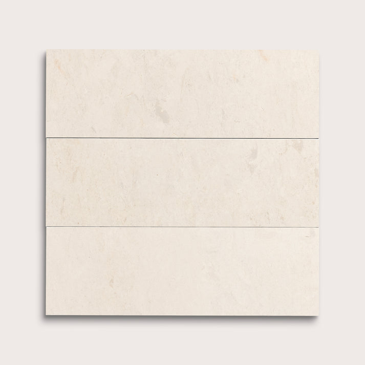 three rectangle tiles with a beige limestone pattern on a white background