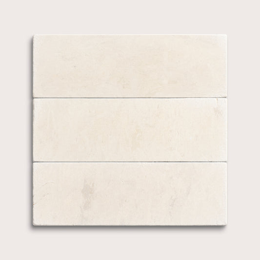 three rectangle tiles with a beige limestone pattern on a white background