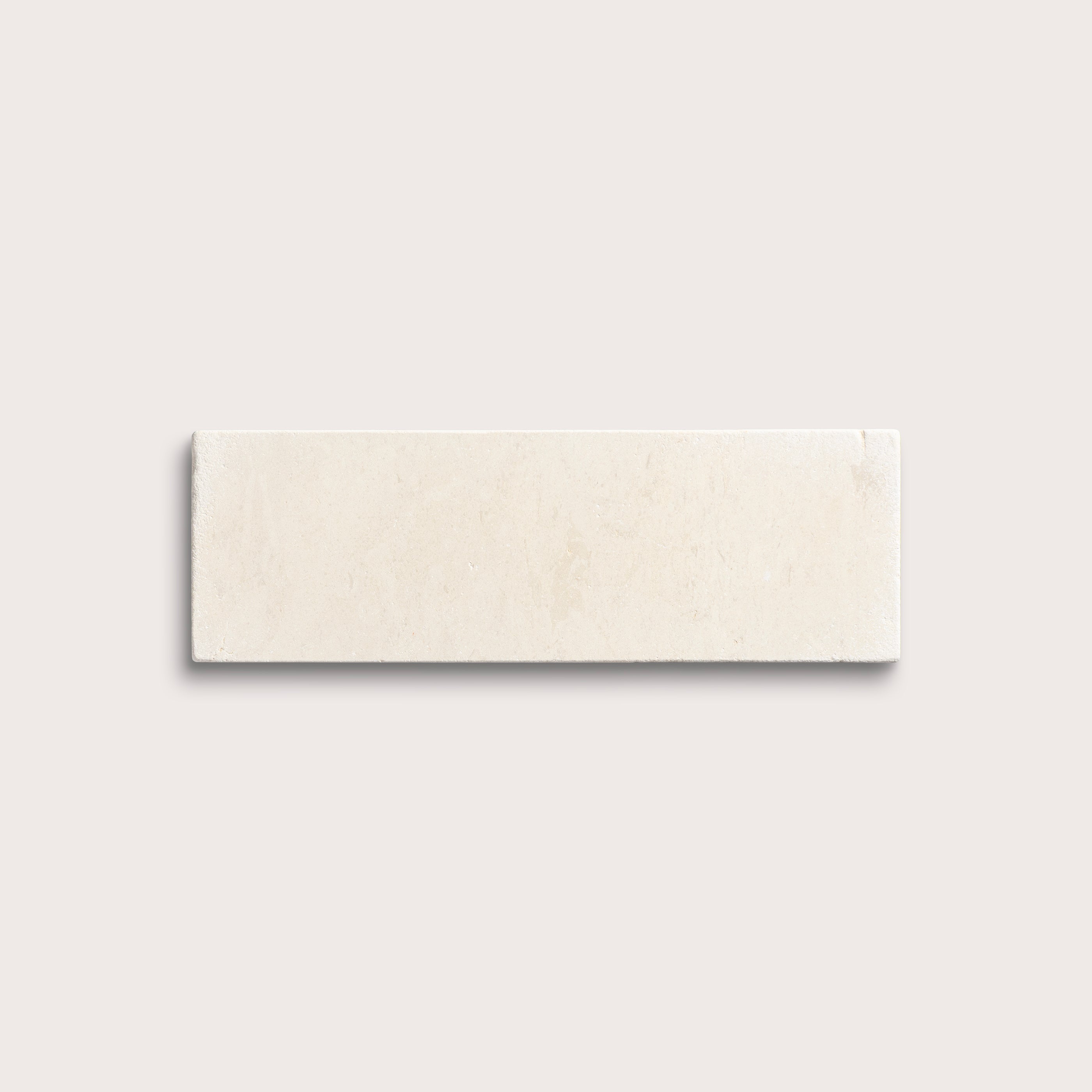 rectangle tile with a beige limestone pattern on a white background