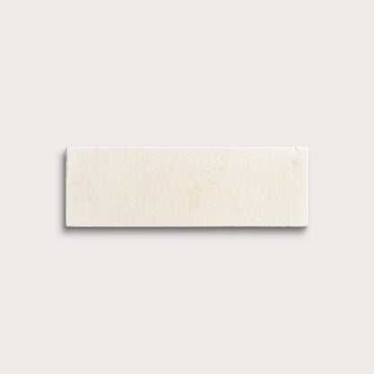 rectangle tile with a beige limestone pattern on a white background
