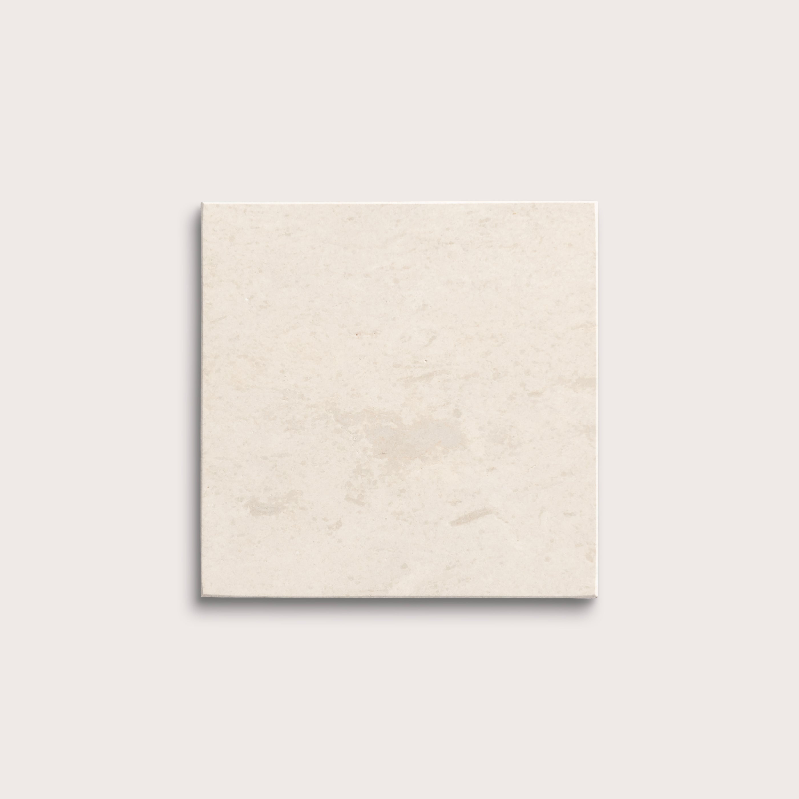 square tile with a beige limestone pattern on a white background