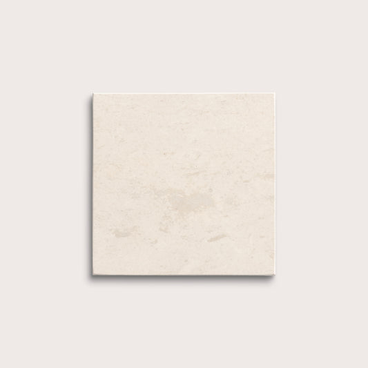 square tile with a beige limestone pattern on a white background