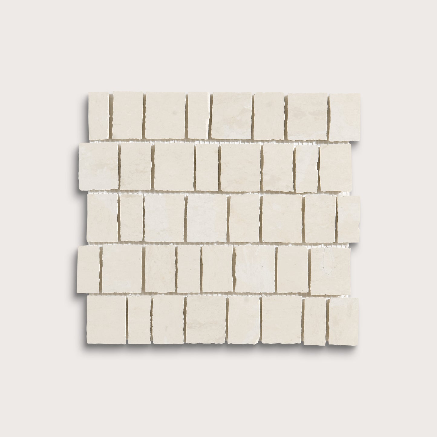 A square sample of small rectangular off-white stone mosaic tiles arranged in staggered rows on a light neutral background.