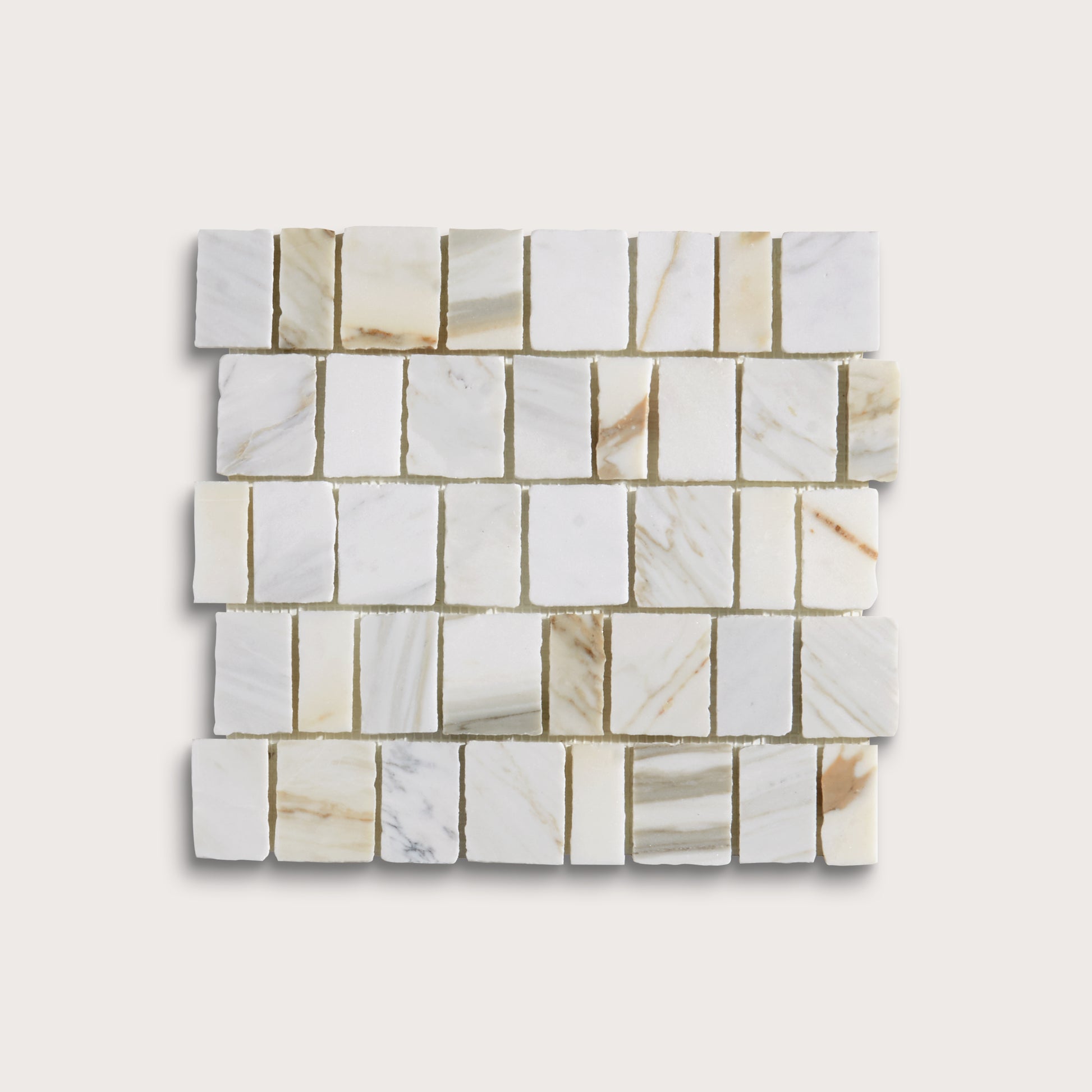A square sample of white marble mosaic tiles with natural beige and light brown veining, arranged in a staggered brick pattern against a light beige background.
